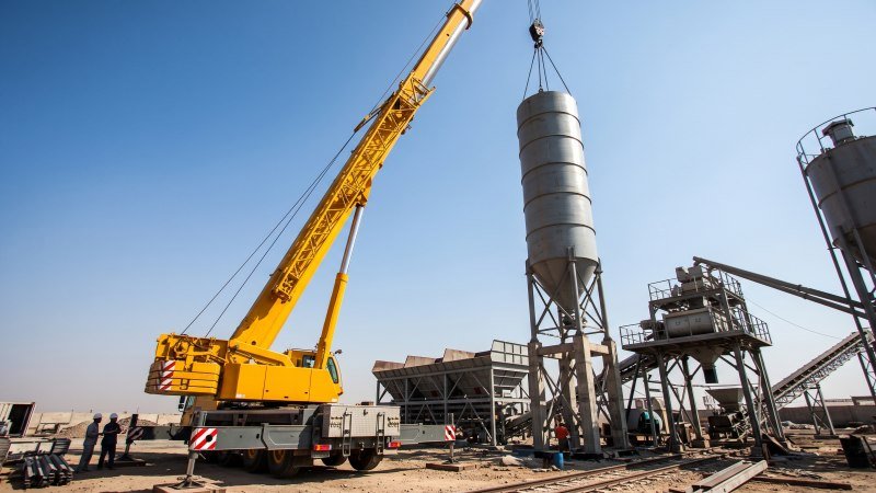 Crane Lifting Cement Silo During Assembly