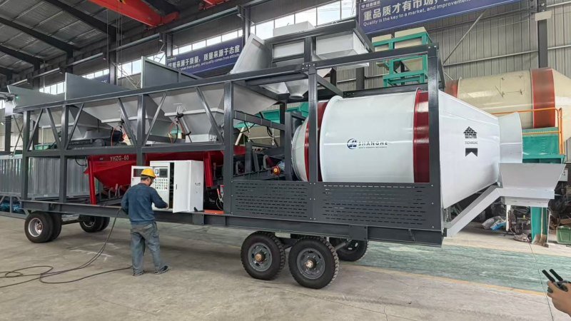 Factory Worker Testing Control Panel Of Mobile Concrete Plant