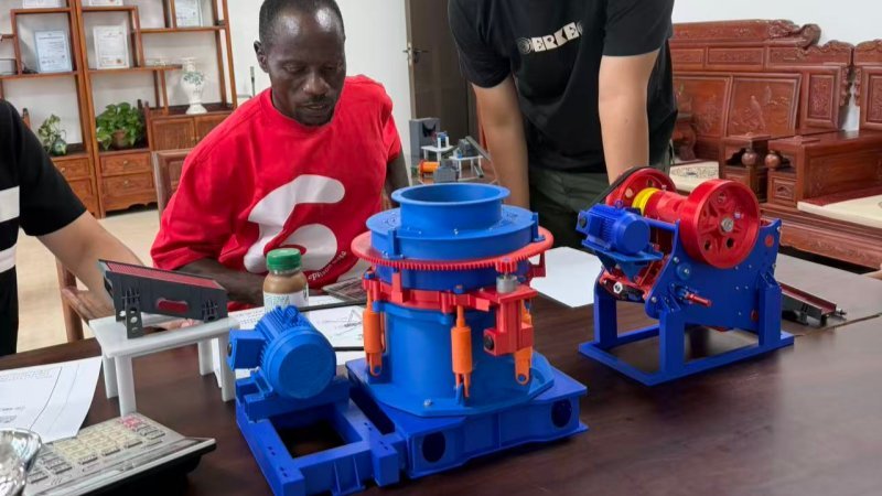 Ghana Client Inspecting Crusher Scale Models With Engineers
