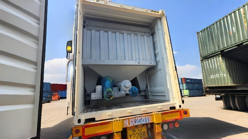 Large Aggregate Bin Securely Loaded Into Shipping Container