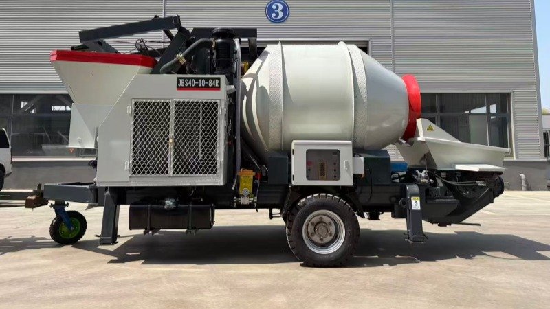 Side View Of Compact Concrete Mixer Pump On Towable Chassis